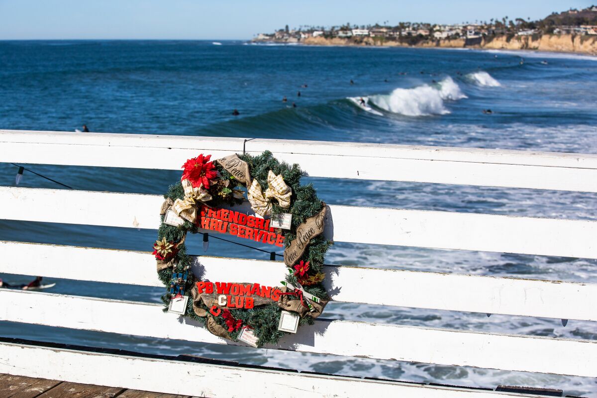 The Pacific Beach Woman's Club is among many organizations that has decorated Crystal Pier with a holiday wreath.