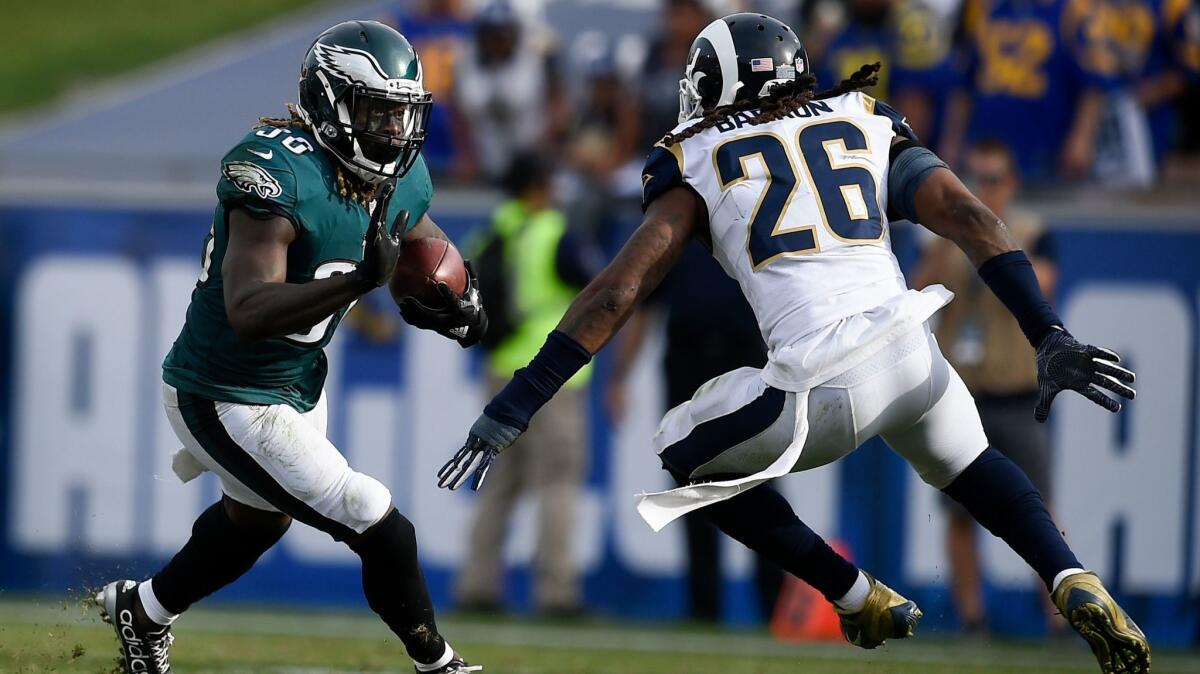Rams linebacker Mark Barron makes a play on Philadelphia Eagles running back Jay Ajayi during their Dec. 10 game at the Coliseum.