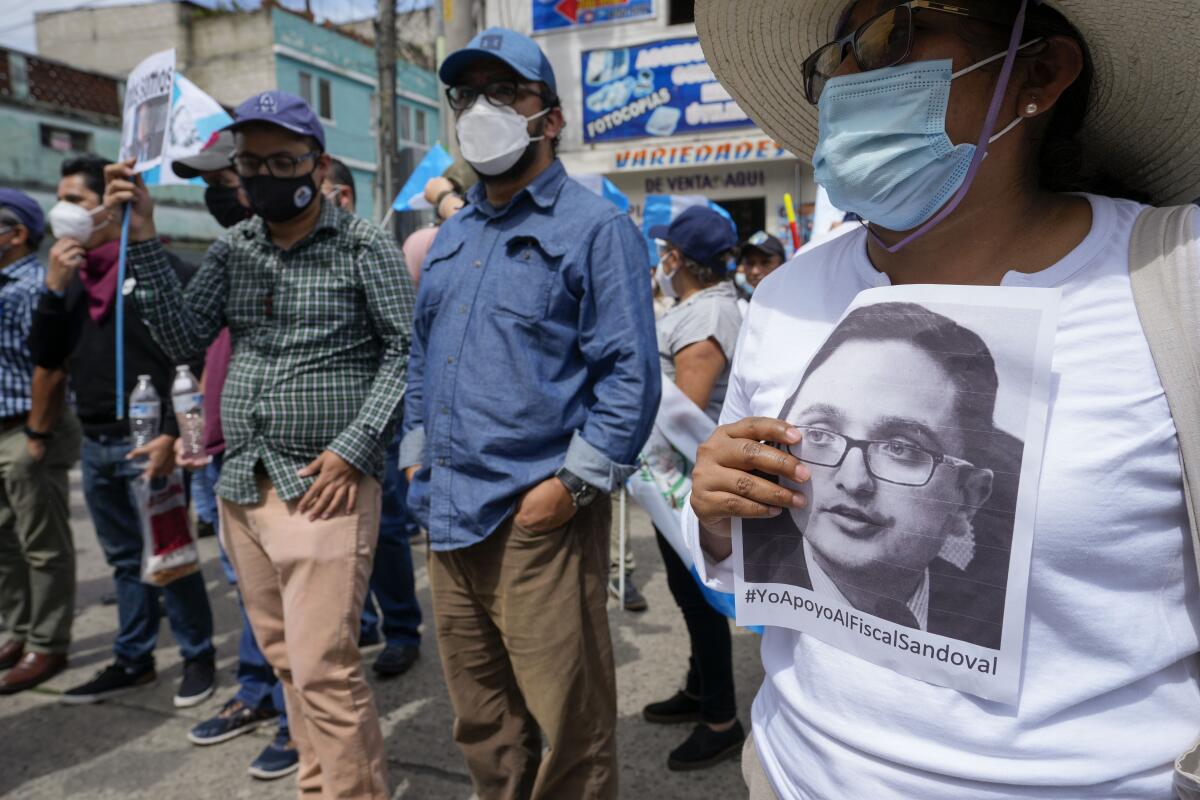 People attend a rally in support of anti-corruption prosecutor Juan Francisco Sandoval in Guatemala City