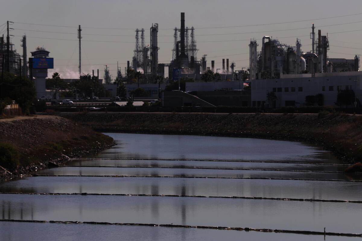 A waterway leads to a refinery.