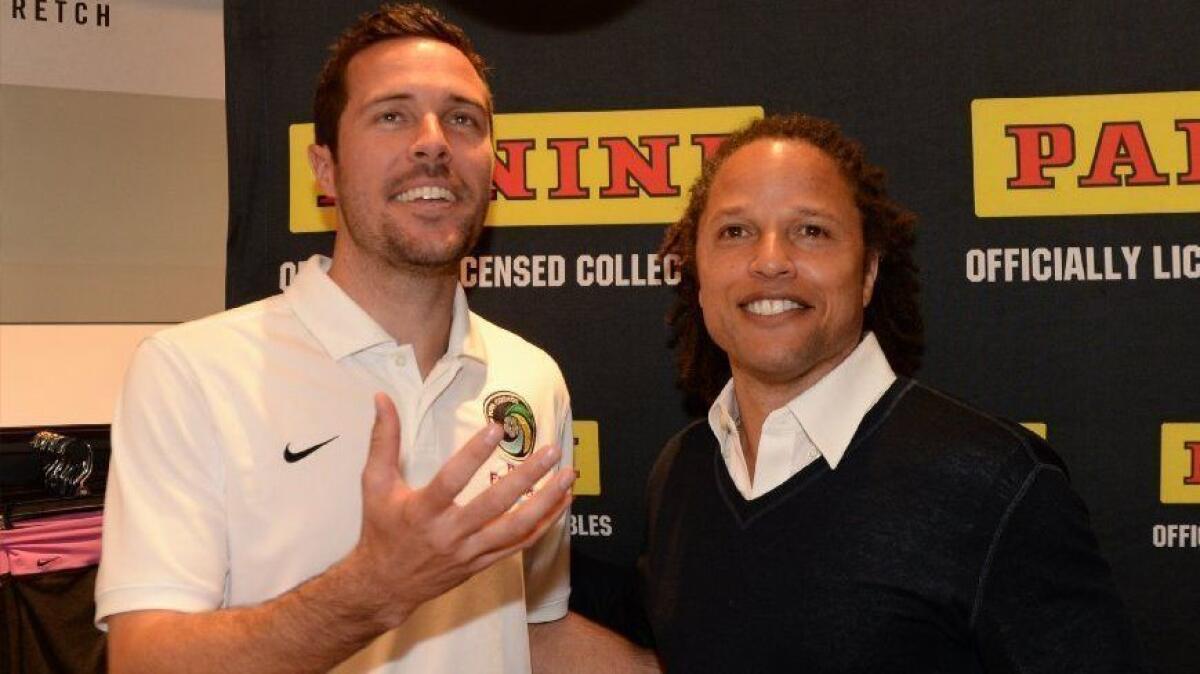 Former L.A. Galaxy midfielder Cobi Jones, right, shown with fellow soccer pro Hunter Freeman in 2014, has sold an income property in West Hills for $912,500.