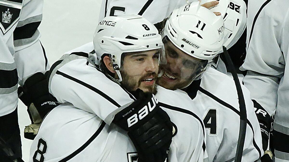 Kings center Anze Kopitar, right, hugs teammate Drew Doughty after the team's Game 7 win over the Chicago Blackhawks. Doughty is considered a favorite to be named the most valuable player of the playoffs.