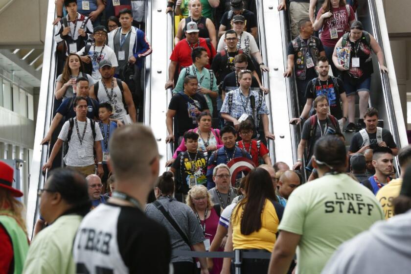 7/18/2019 9:03:49 AM Headline:Opening Day for Comic-Con InternatinalByline:Nelvin C. CepedaCaption:On opening day for Comic-Con International, fans on Thursday July 18, 2019 ride a pack escalator down towards the main convention floor for Comic-Con.Writer:Title:PhotographerObject Name:SlugCredit:The San Diego Union-Tribune