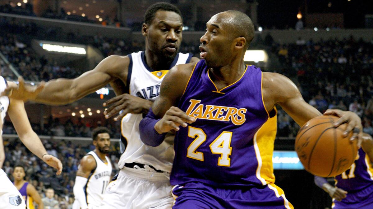 Lakers guard Kobe Bryant looks for some room to operate against Grizzlies guard Tony Allen in the first half Sunday.