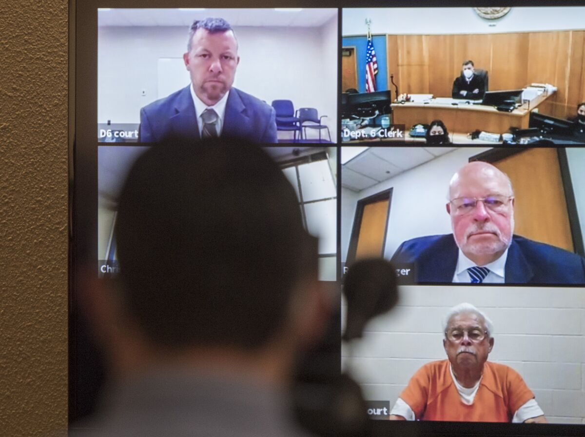 Defendants Paul Flores and his father, Ruben Flores, appear via video conference during their arraignment in 2021