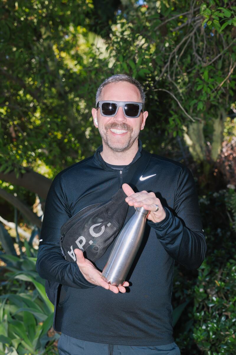 Alex Holt said he chose his particular S'well water bottle, which he toted along for a hike at Runyon Canyon, because it matches his lunchbox. The stainless steel finish fits his personal brand, his friends told him.