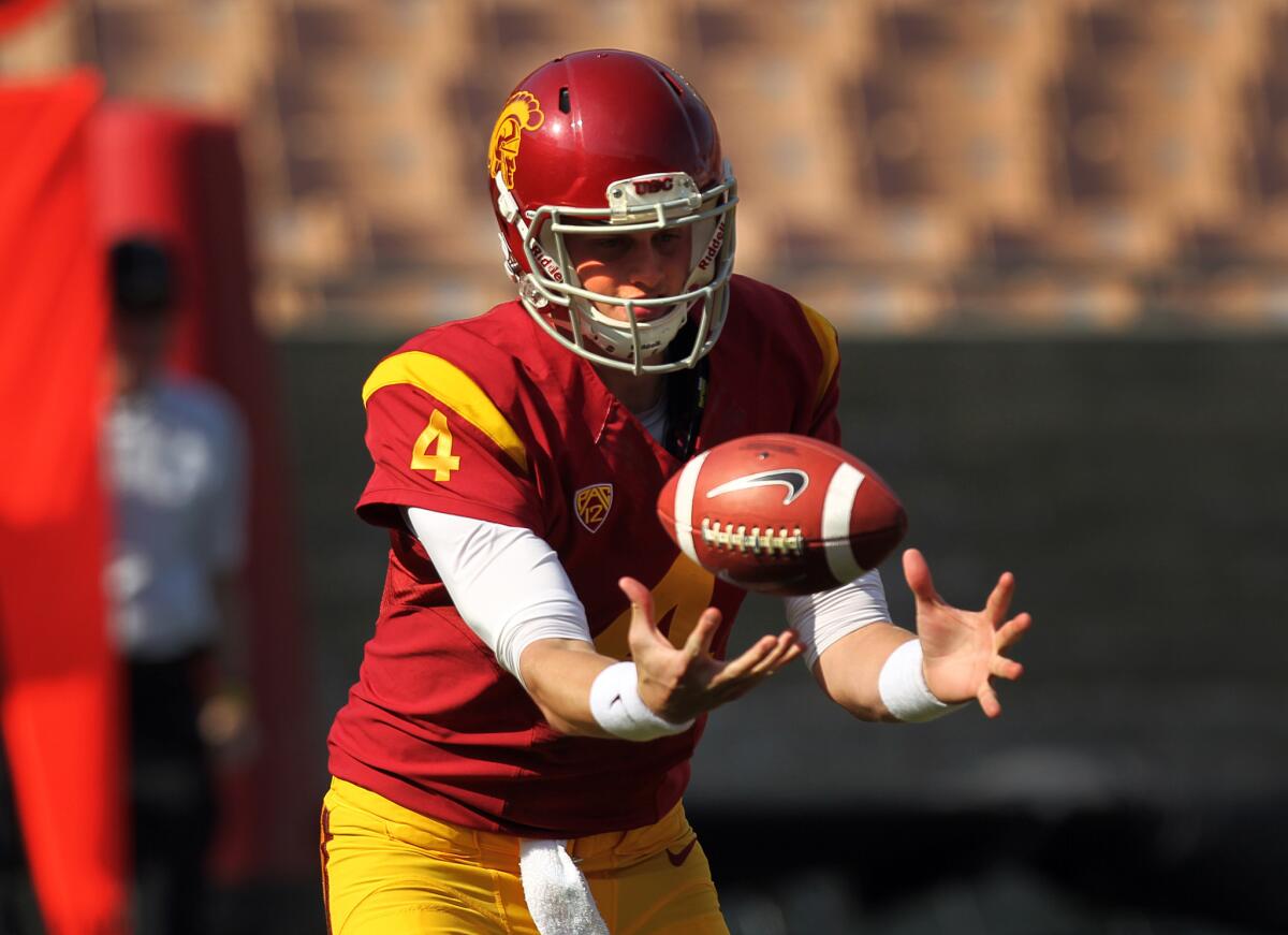 USC backup quarterback Max Browne bobbles a snap during the 2014 spring game.