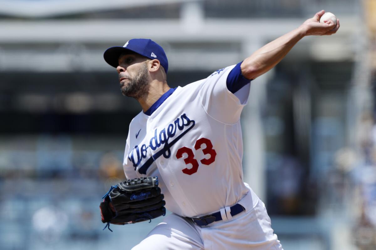 Los Angeles Dodgers starting pitcher David Price throws to a New York Mets.