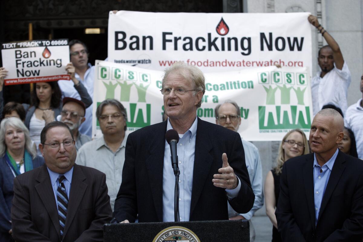 Actor activist Ed Begley Jr. is flanked by Los Angeles City Councilmen Paul Koretz, left, and Mike Bonin at a news conference urging a moratorium on fracking activity in Los Angeles on the steps of City Hall in September 2013.