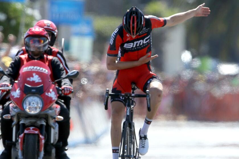 Taylor Phinney takes a bow atop his bicycle after winning the Tour of California's fifth stage on Thursday afternoon in Santa Barbara.
