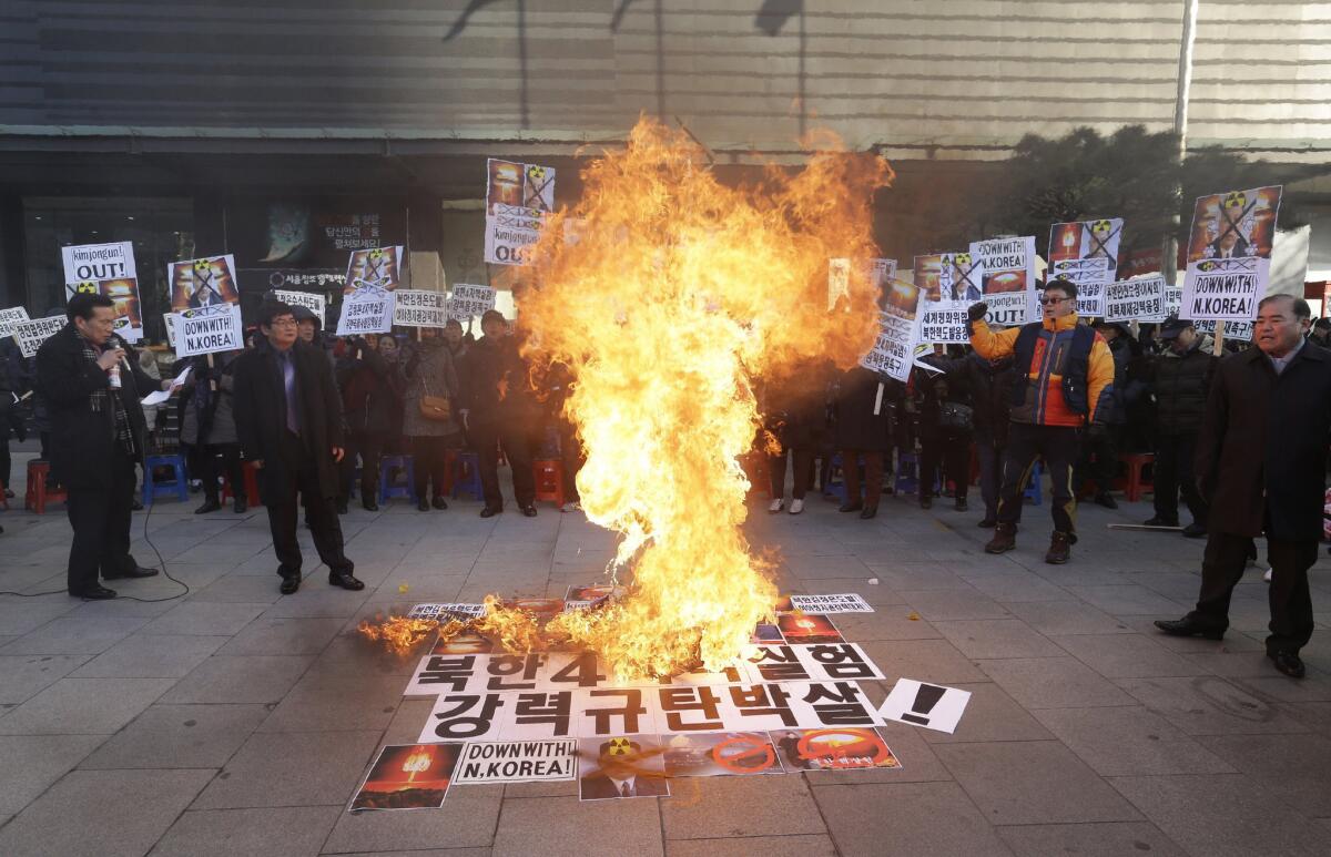 South Koreans burn North Korean leader Kim Jong Un in effigy at a Jan. 7 Seoul rally against Pyongyang's announcement that it had tested a hydrogen bomb.