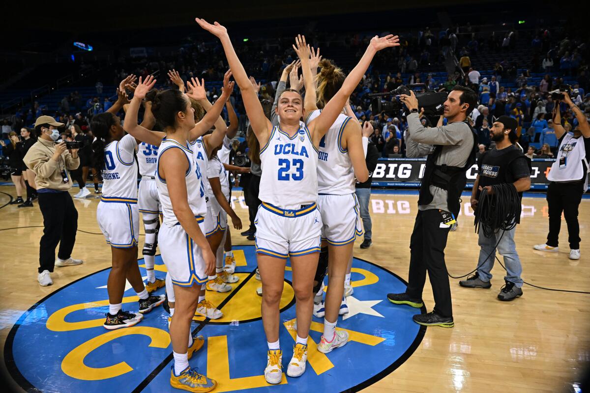 UCLA forward Gabriela Jaquez waves to the crowd as the Bruins celebrate their win over Sacramento State.