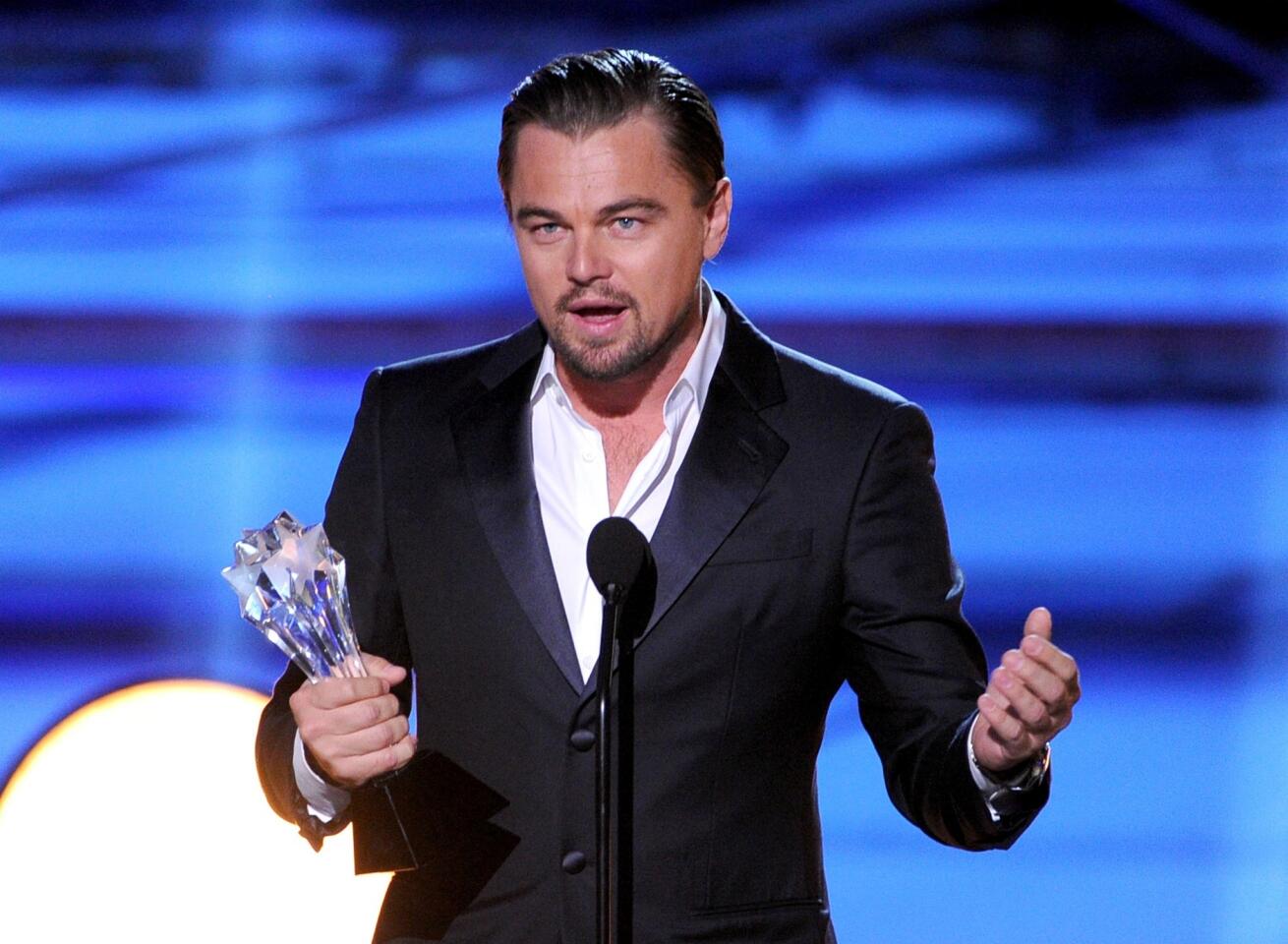 Actor Leonardo DiCaprio accepts the award for actor in a comedy for his work in "The Wolf of Wall Street."