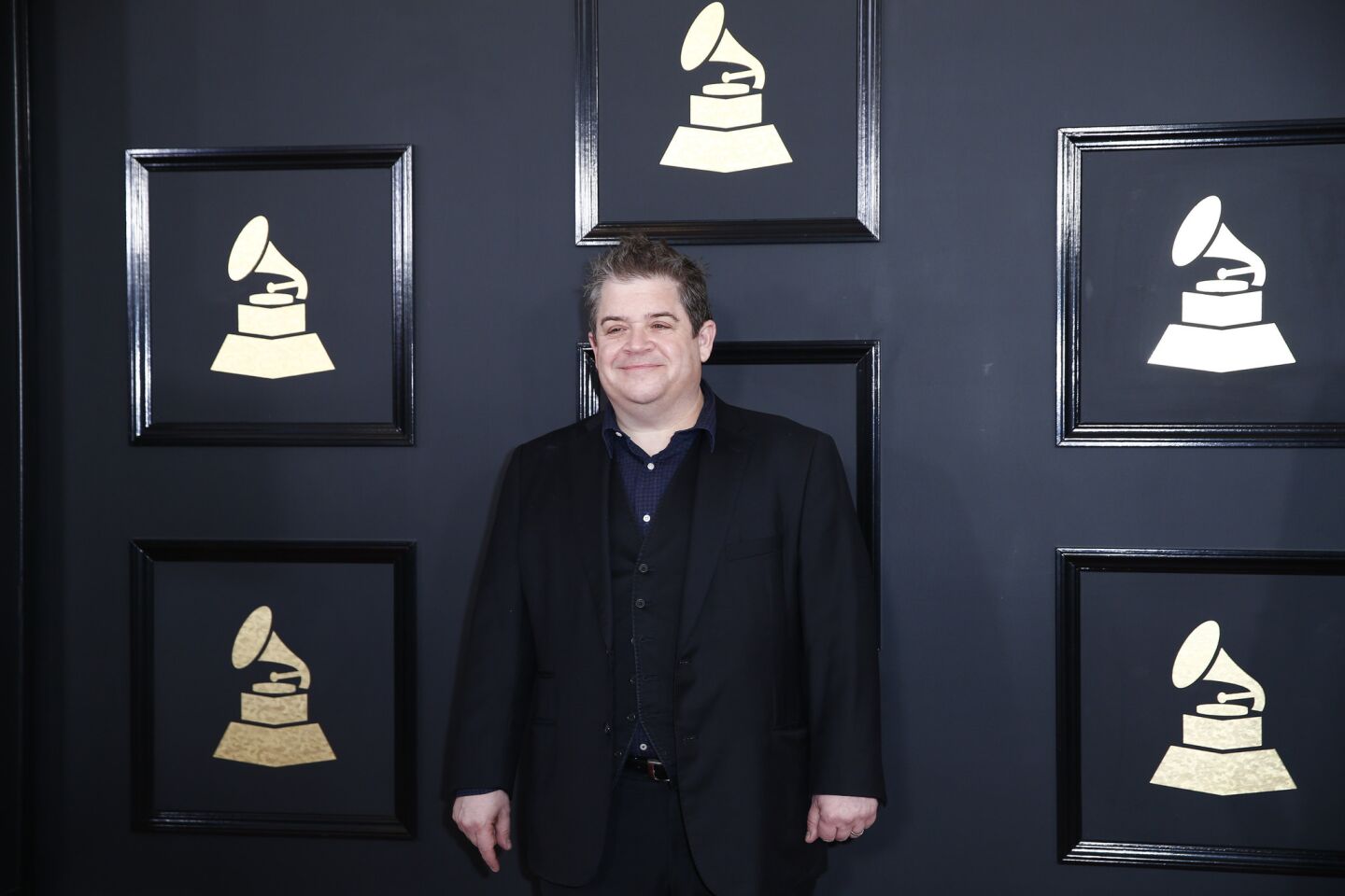 Patton Oswalt arrives at the 59th Grammy Awards.