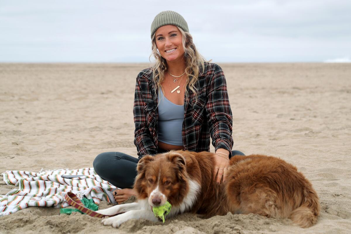 Newport Beach yoga instructor Chelsey Lowe, 30, and her Australian shepherd Gryffin.