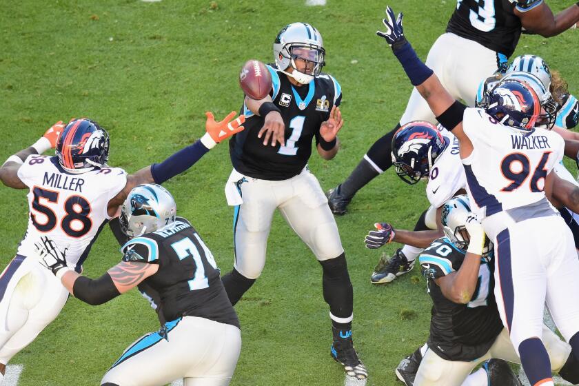 Panthers quarterback Cam Newton (1) throws a pass against the Broncos during Super Bowl 50.