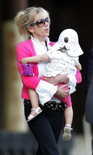 Rielle Hunter, holding her daughter, leaves the Terry Sanford Federal Building and Courthouse in Raleigh, N.C., in August 2009.