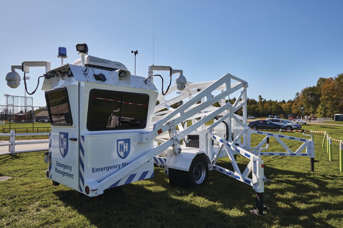 The SkyWatch booth is mounted on a trailer that is equipped with hydraulic lifts to raise and lower the platform.