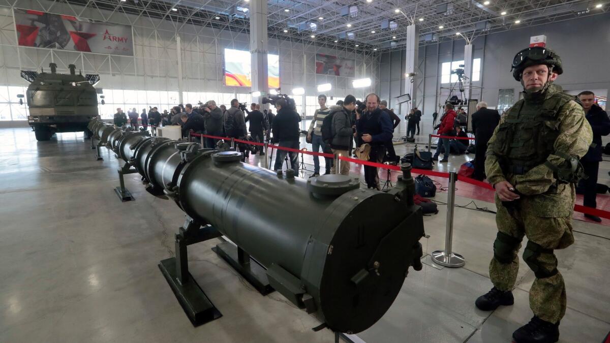 A Russian soldier stands near an Iskander M Missile during a Jan. 23 briefing in Moscow.