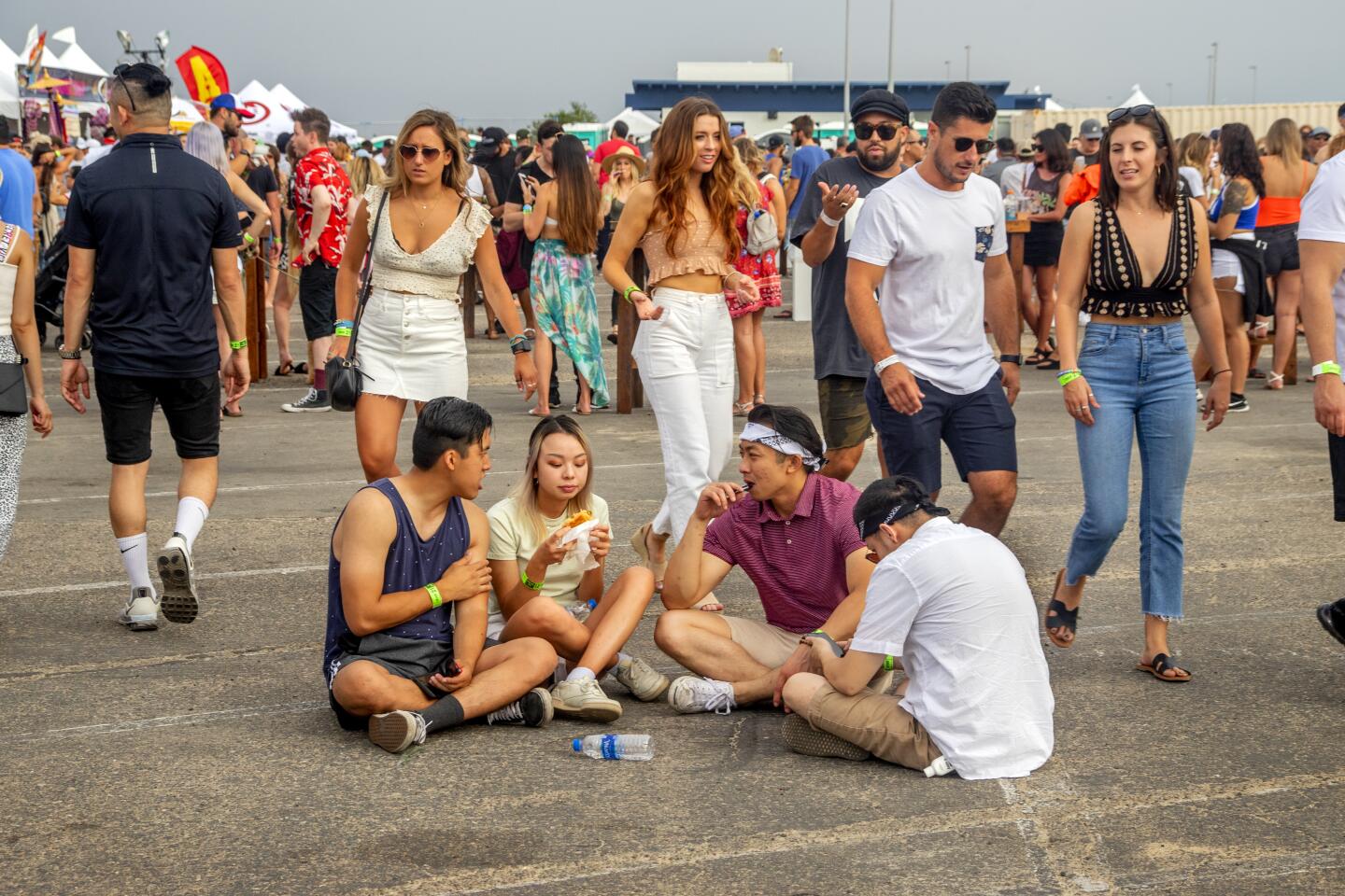 Sit-down diners find a place to eat at Sunday's Nood Beach festival in Huntington Beach.