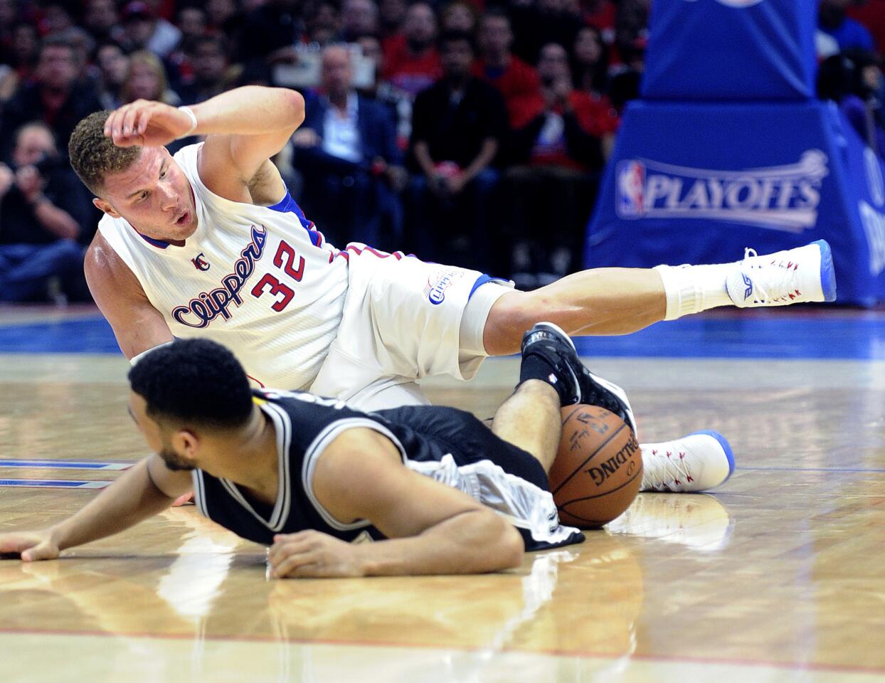 Clippers forward Blake Griffin and Spurs guard Cory Joseph collide after Clippers guard Chris Paul (not pictured) committed a foul in the first half of Game 1 on Sunday night at Staples Center.