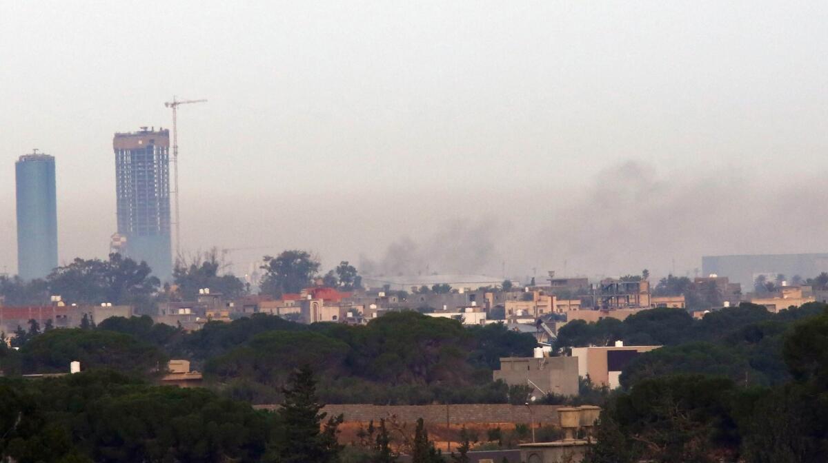 Smoke billows from the scene of fighting on the fringes of Libya's militia-occupied capital, Tripoli, on Nov. 25, 2014. Chaos has escalated in recent days with airstrikes, kidnappings and killings among rival militant groups.