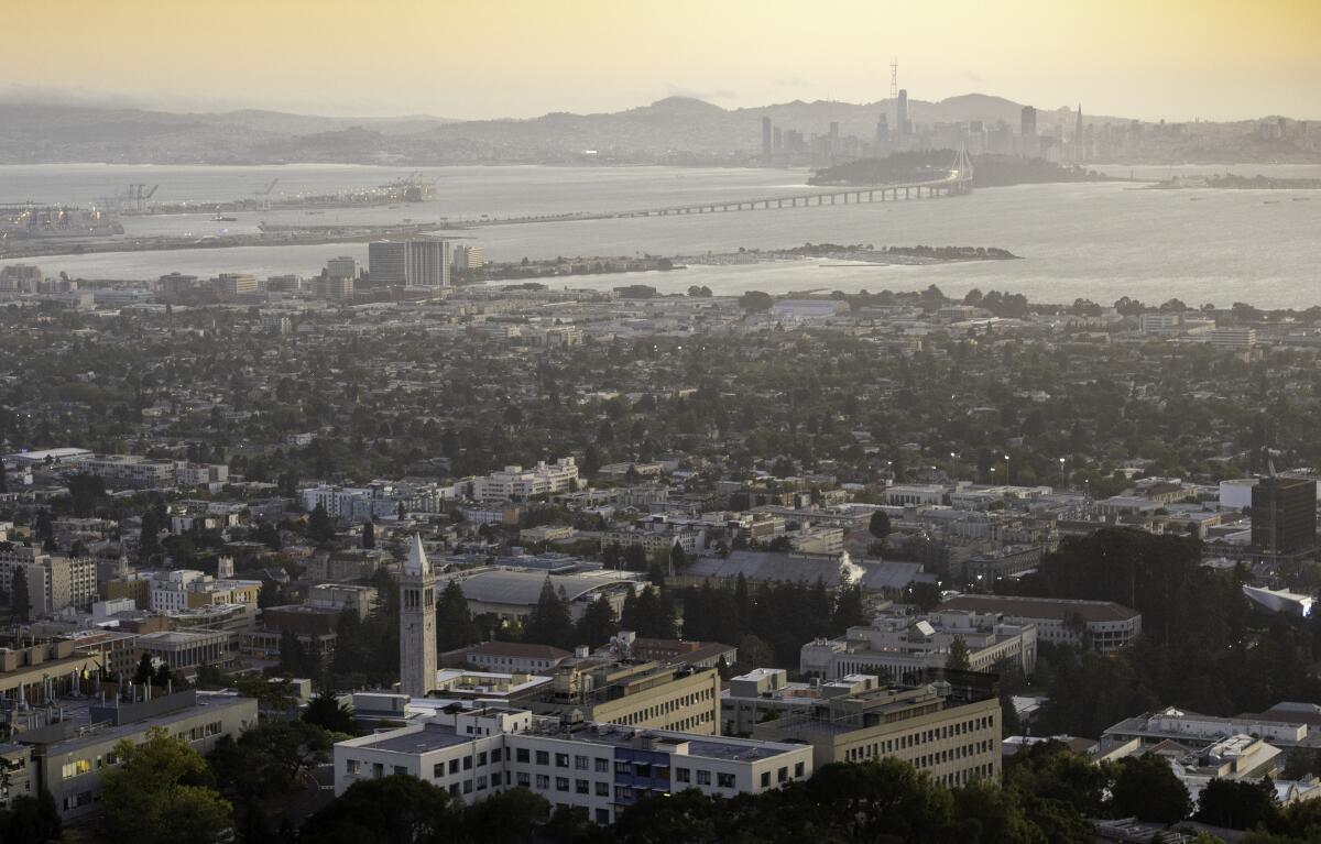 The UC Berkeley campus is seen against the backdrop of the San Francisco skyline. 