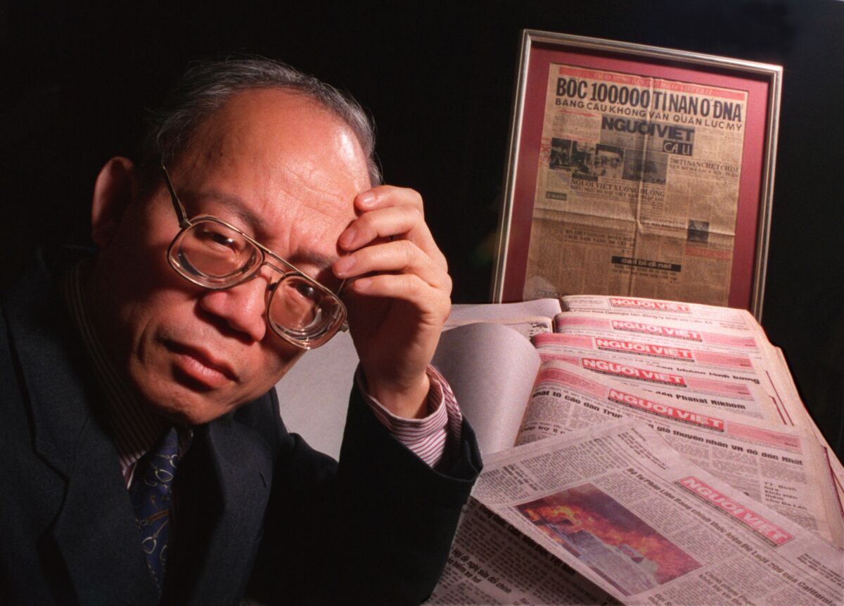 Yen Ngoc Do, publisher and founder of Nguoi Viet Daily News, with bound copies and a framed first edition of his paper at the publication's Westminster office in January 1997.