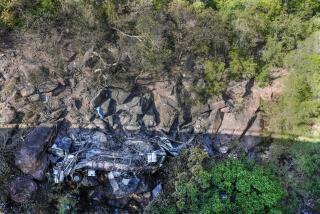 The wreckage off a bus lays in a ravine a day after it plunged off a bridge on the Mmamatlakala mountain pass between Mokopane and Marken, around 300km (190 miles) north of Johannesburg, South Africa, Friday, March 29, 2024. A bus carrying worshippers on a long-distance trip from Botswana to an Easter weekend church gathering in South Africa plunged off a bridge on a mountain pass Thursday and burst into flames as it hit the rocky ground below, killing at least 45 people, authorities said. The only survivor was an 8-year-old child who was receiving medical attention for serious injuries. (AP Photo/Themba Hadebe)