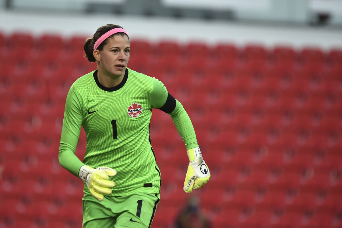 FILE - Canada's Stephanie Labbe watches during the women's international friendly soccer match between England and Canada at Bet365 stadium in Stoke on Trent, England, Tuesday, April 13, 2021. Stephanie Labbe, the goalkeeper for the Canadian women's national team that won the gold medal at the Tokyo Olympics, has announced her retirement. Labbe released an emotional video on Wednesday, Jan. 19, 2021. (AP Photo/Rui Vieira, File)
