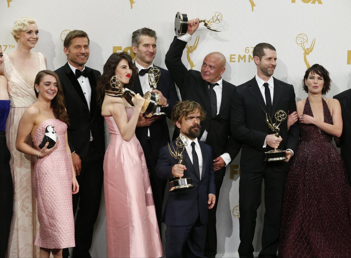 Cast members and producers of HBO's "Game of Thrones" celebrate backstage at the Emmy Awards at the Microsoft Theater on Sept. 20