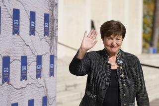 FILE - International Monetary Fund President Kristalina Georgieva waves as she arrives for a meeting of G20 finance and health ministers at the Salone delle Fontane (Hall of Fountains) in Rome, Oct. 29, 2021. (AP Photo/Alessandra Tarantino, File)