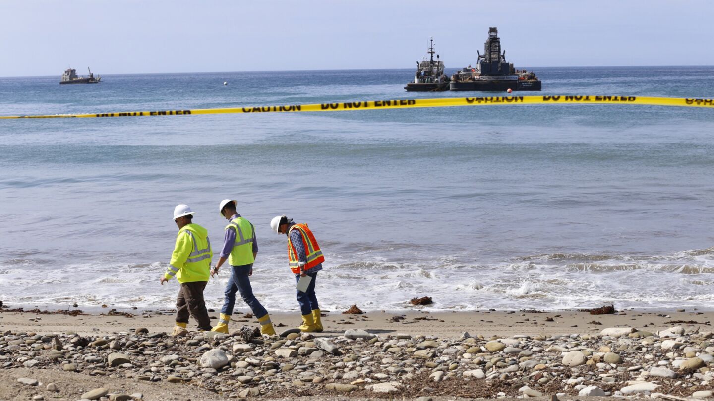 With boats offshore, cleanup efforts continue at Refugio State Beach on Thursday morning June 4, 2015.