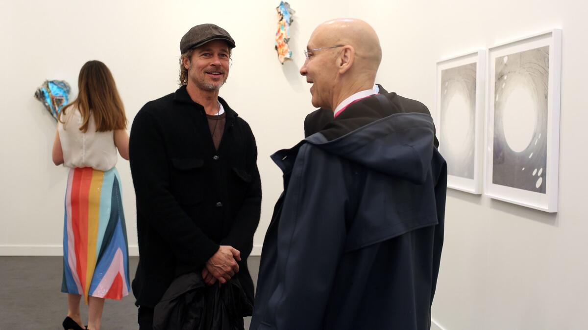 Brad Pitt stands in a gallery at Frieze Los Angeles in 2019.