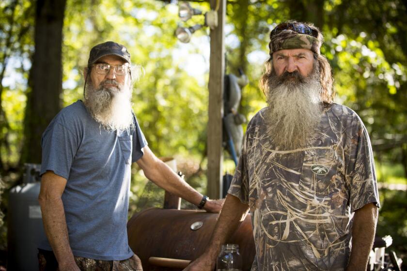 Brothers Silas "Uncle Si" Robertson, left, and Phil Robertson from the series "Duck Dynasty." Phil Robertson was suspended last week for disparaging comments he made to GQ magazine about gay people.