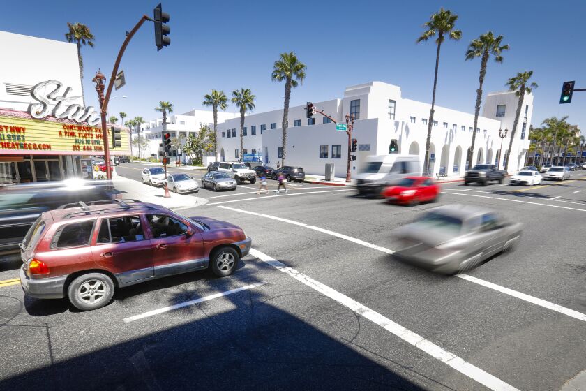 Traffic travels along Coast Highway at the intersection of Civic Center Drive, August 15, 2019, in Oceanside, California not far from the Oceanside Civic Center in the background. It is one of six intersections in the city that will have a roundabout installed.