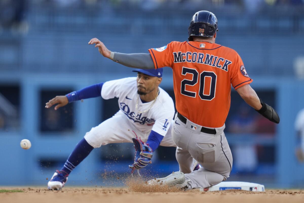 Dodgers second baseman tags out Houston Astros' Chas McCormick on a steal attempt on June 25, 2023, at Dodger Stadium.
