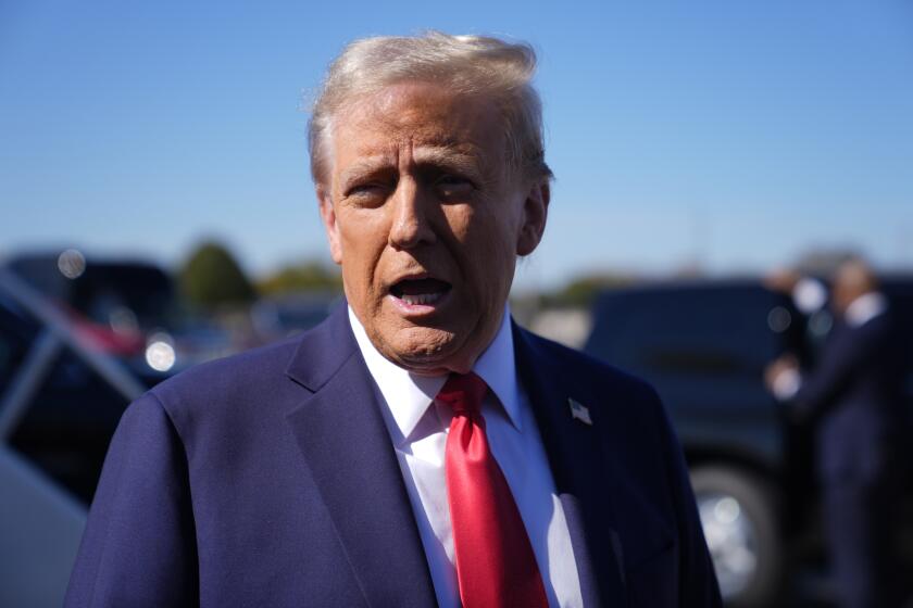 Republican presidential nominee former President Donald Trump speaks with reporters upon arrival at Philadelphia International Airport, Sunday, Oct. 20, 2024, in Philadelphia. (AP Photo/Evan Vucci)