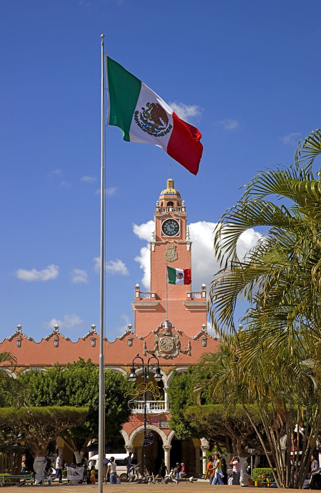 Mexican flags fly in front of City Hall in Merida, the capital of Yucatan state.