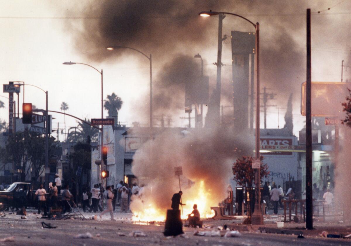 Rioters at Florence and Normandie. (Kirk McKoy / Los Angeles Times)