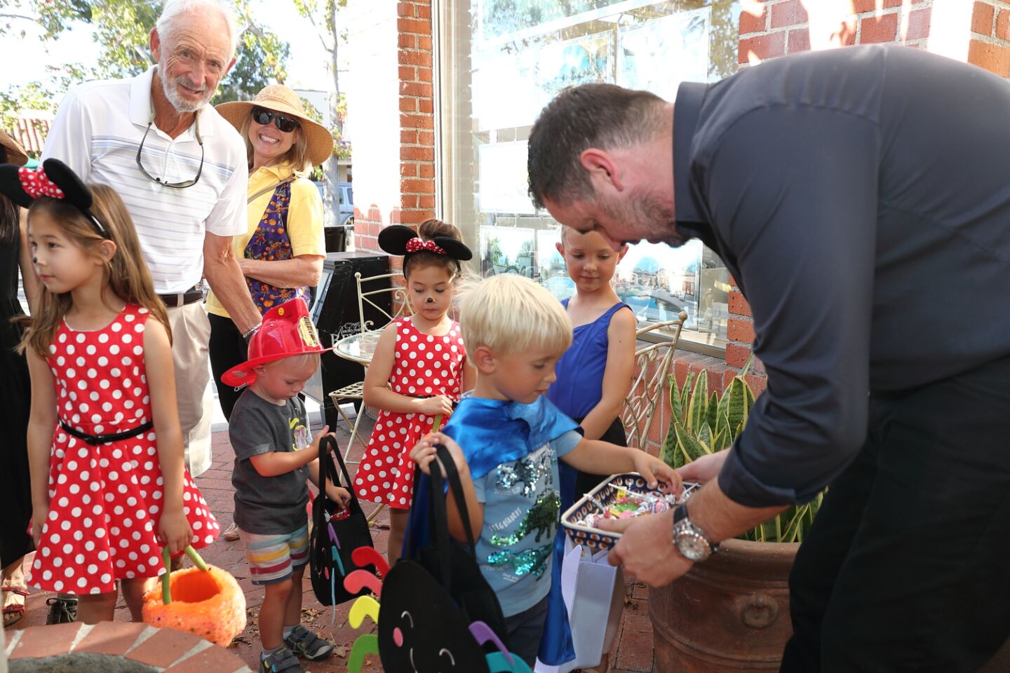 The Gustafson and Bills families stopped to get candy from Matt Palmquist at RSF Escrow
