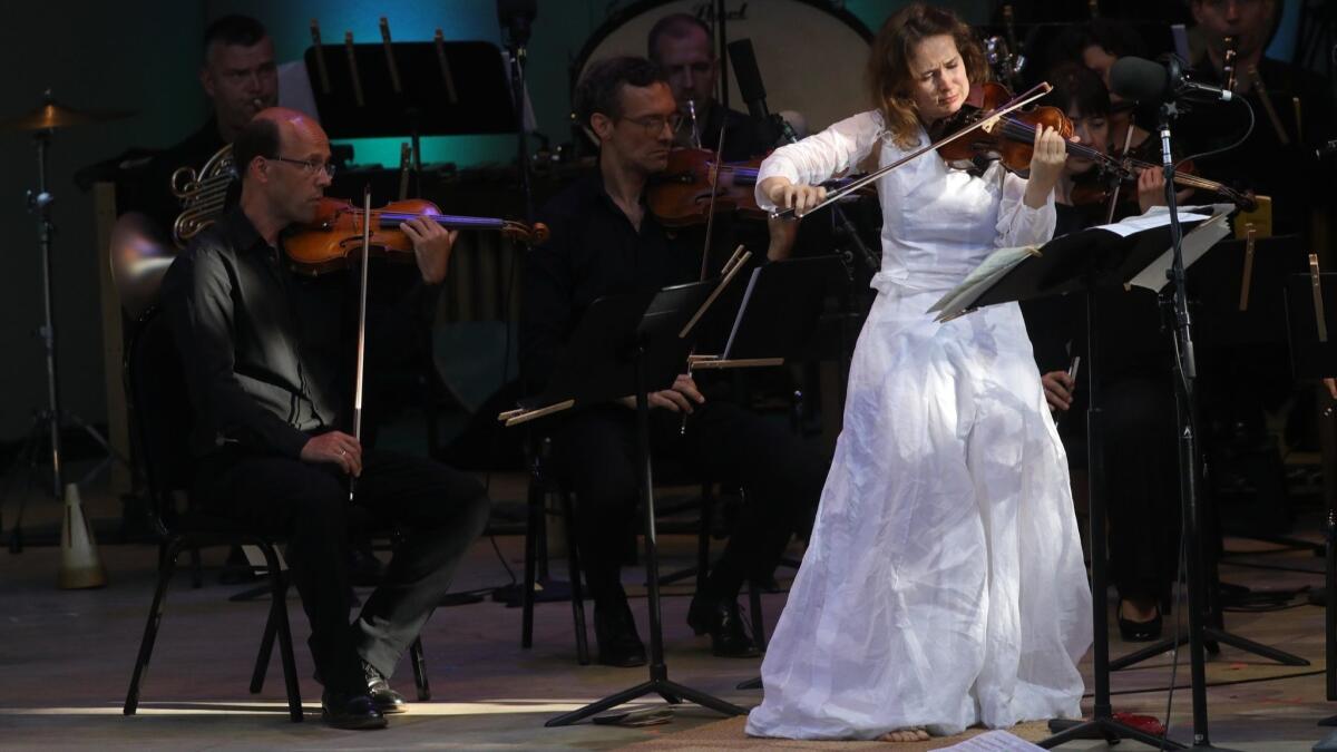 Violinist Patricia Kopatchinskaja concludes the Ojai Music Festival as soloist in Ligeti's Violin Concerto with the Mahler Chamber Orchestra at the Libbey Bowl on Sunday afternoon.
