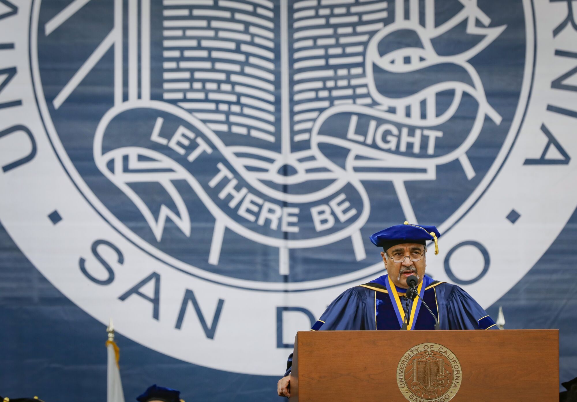 UC San Diego Chancellor Pradeep Khosla addresses graduates during an all campus commencement ceremony at RIMAC Field in 2019.