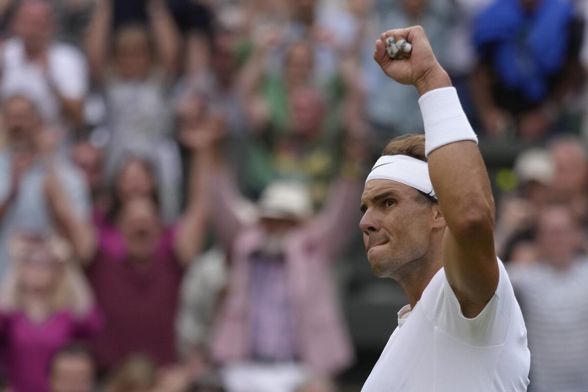 Spain's Rafael Nadal celebrates after beating Southern California's Taylor Fritz during a Wimbledon quarterfinal 