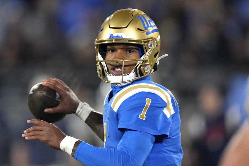 UCLA quarterback Dorian Thompson-Robinson passes during the first half of an NCAA college football game against Arizona 
