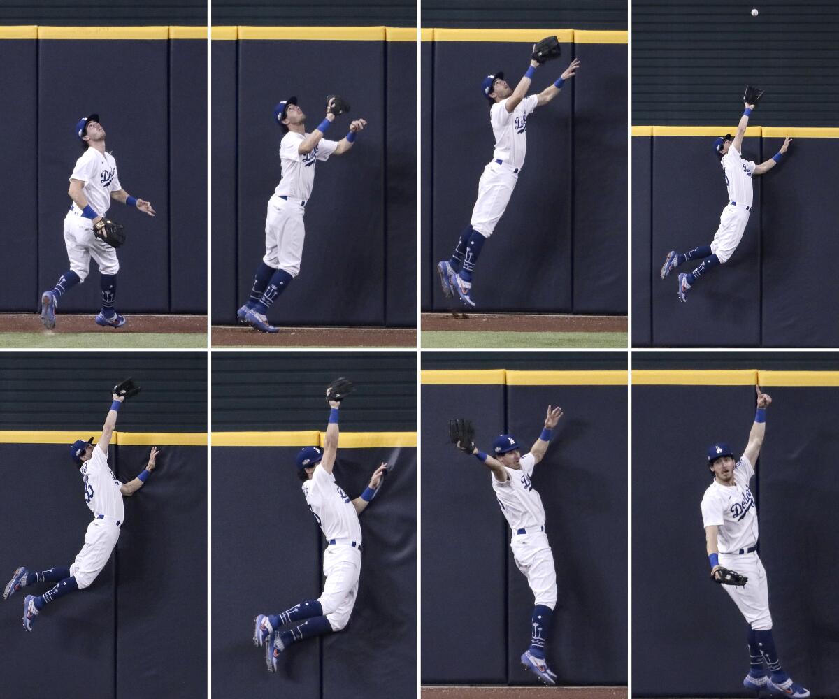 Dodgers center fielder Cody Bellinger (35) as he robs Fernando Tatis Jr. of a 7th inning homer in game two of the NLDS