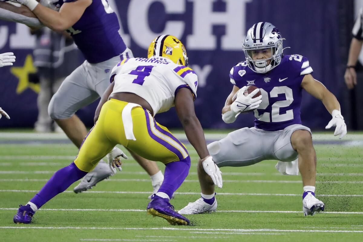 LSU safety Todd Harris Jr. causes Kansas State running back Deuce Vaughn to stop and turn.