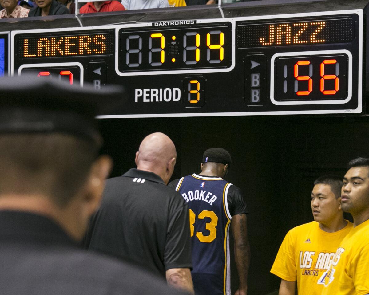 Utah Jazz forward Trevor Booker (33) leaves the floor after being ejected from a game against the Lakers after an altercation with Lakers center Roy Hibbert.
