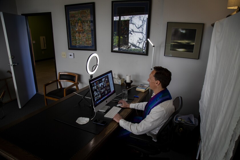 The Rev. Kent Doss delivers a Sunday sermon from his office during a Zoom church service.