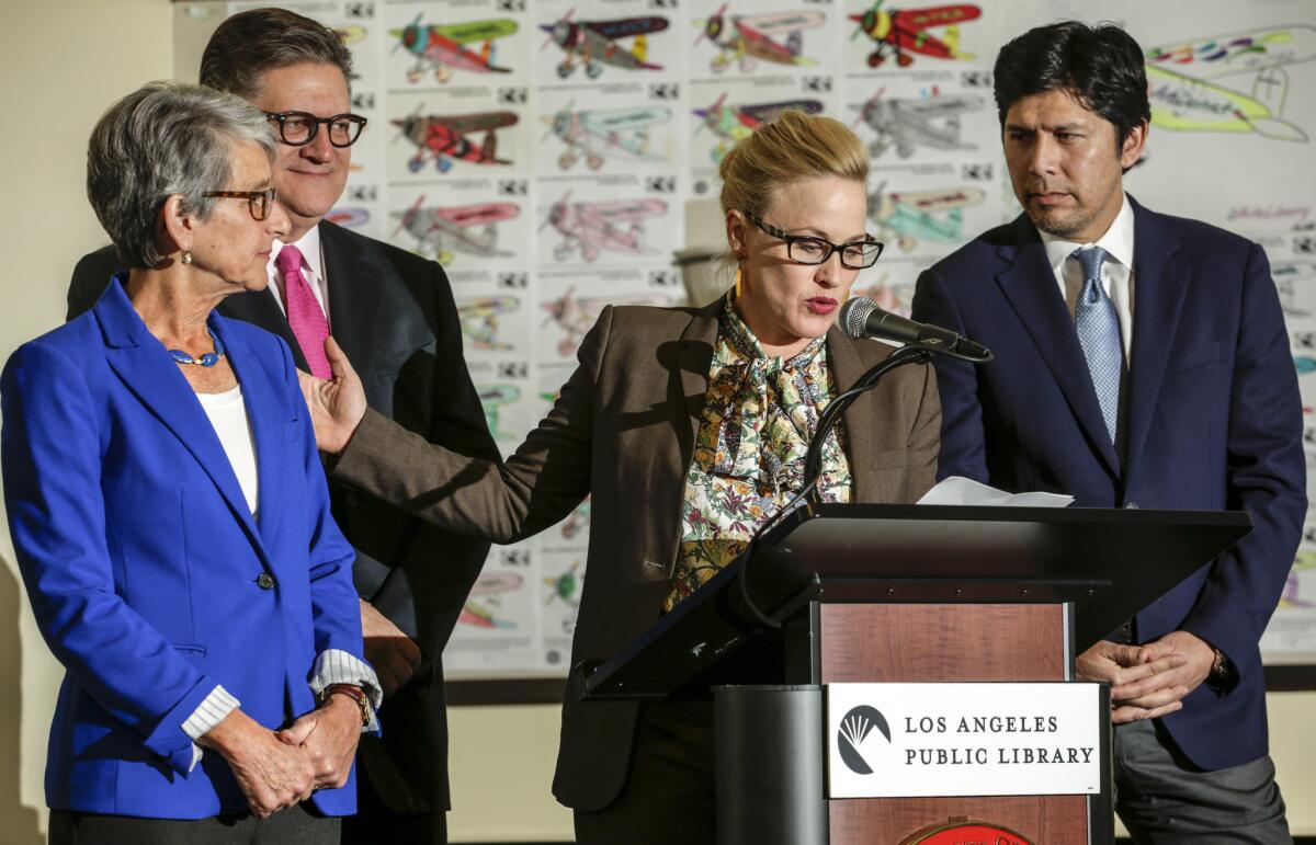 Actress Patricia Arquette addresses a Dec. 29 news conference in North Hollywood to discuss California's new equal-pay law. With Arguette are, from left, state Sen. Hannah-Beth Jackson (D-Santa Barbara), Sen. Bob Hertzberg (D-Van Nuys) and state Senate President Pro Tem Kevin de Leon (D-Los Angeles).